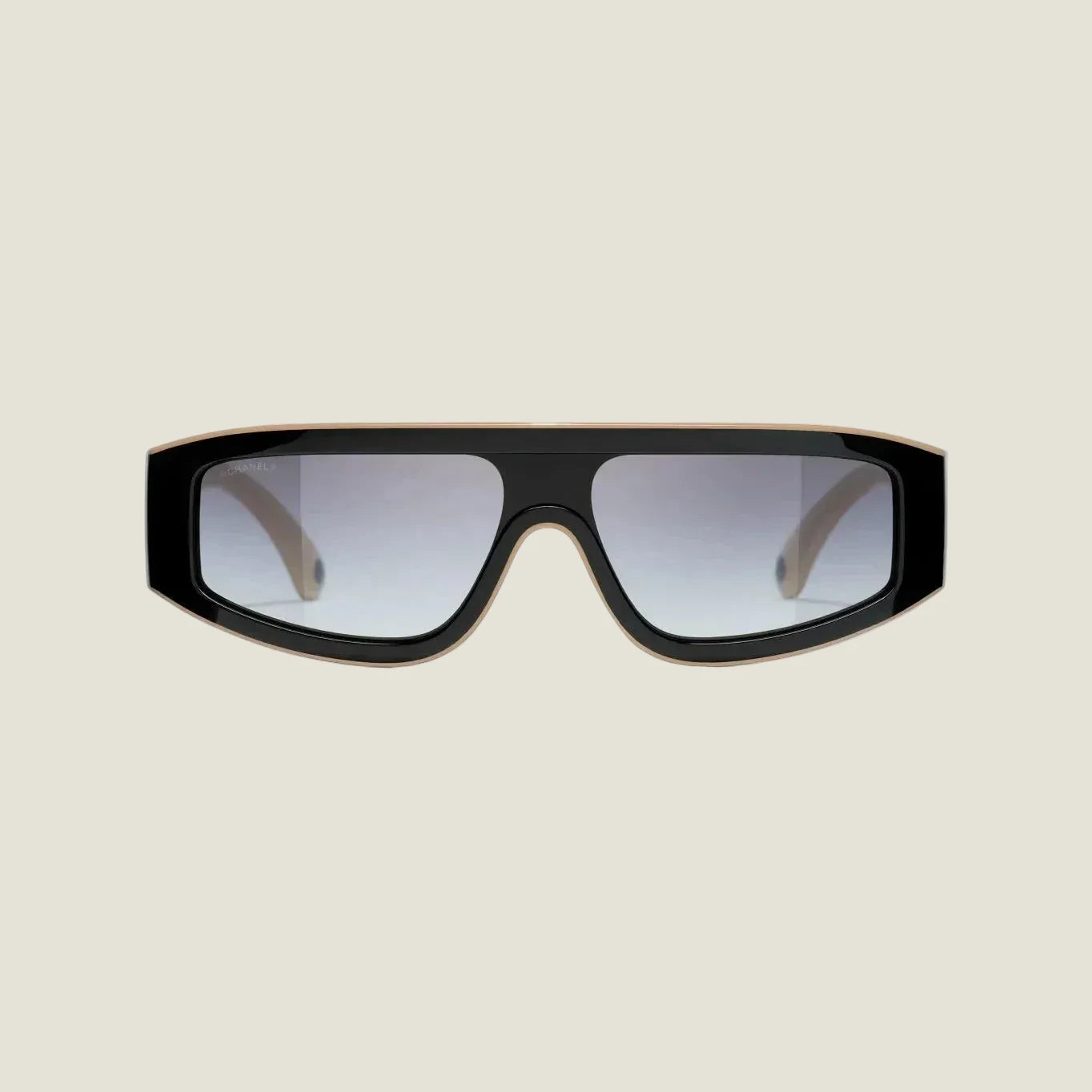 Black and brown CHANEL sunglasses with plastic frame and adjustable nose pads, offering 100% UVA/UVB protection.
