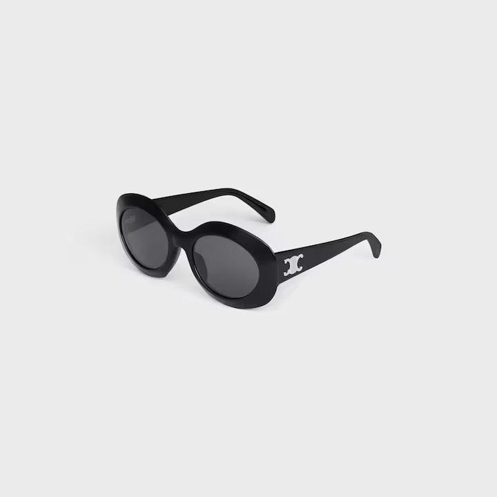 Image of Celine sunglasses with logo, elegant round black frame, UV400 lenses.