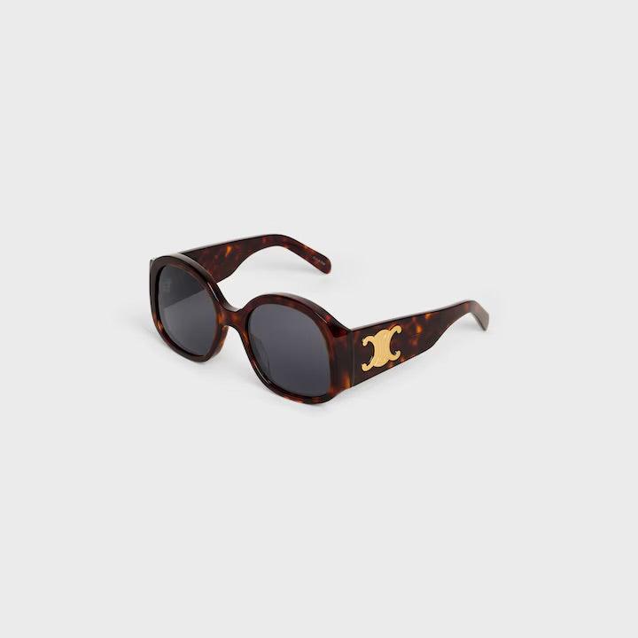 Celine sunglasses with logo, featuring tortoiseshell frame and dark lenses.