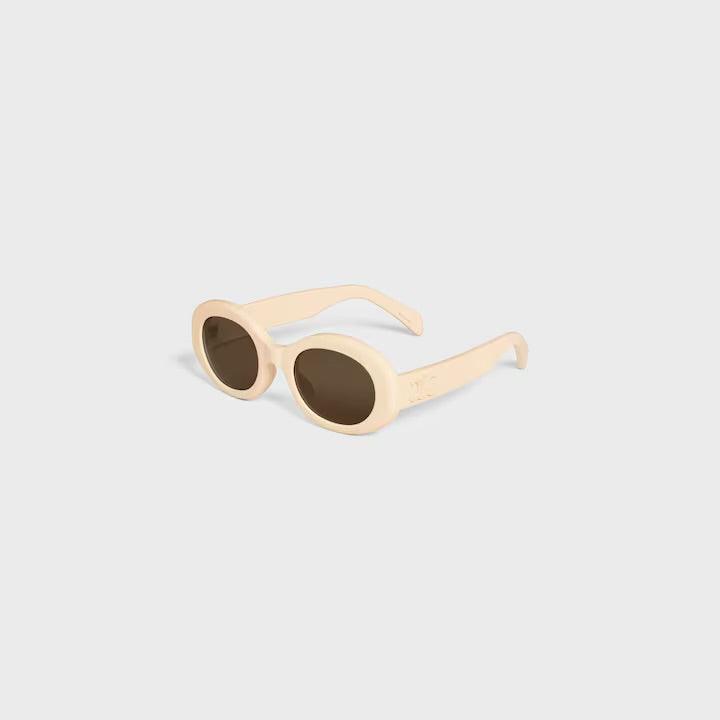 Celine sunglasses with logo, elegant Parisian design, UV400 protection, beige frame, luxury style.