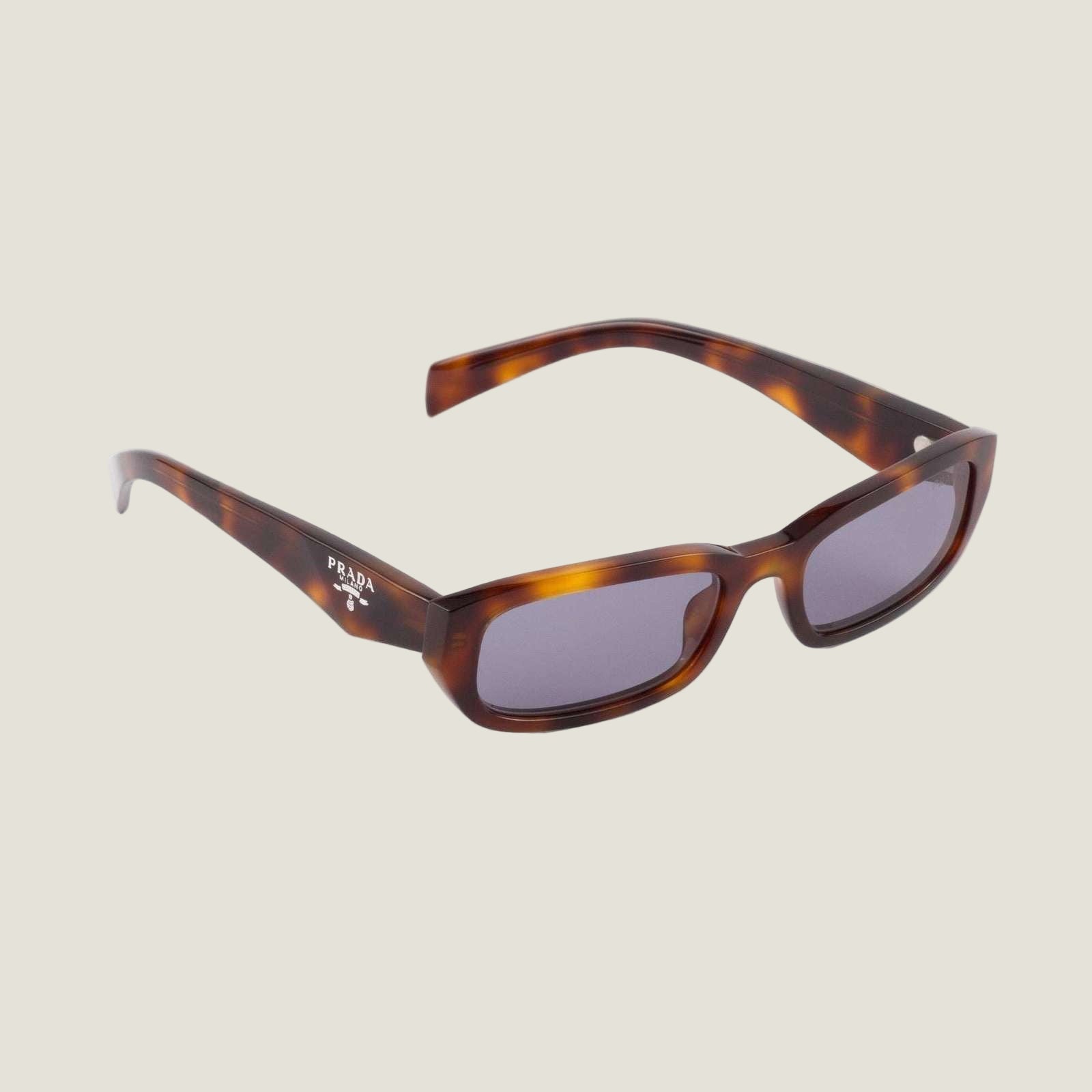 Image of Luxury Prada sunglasses with bold geometric frames and prominent logo.