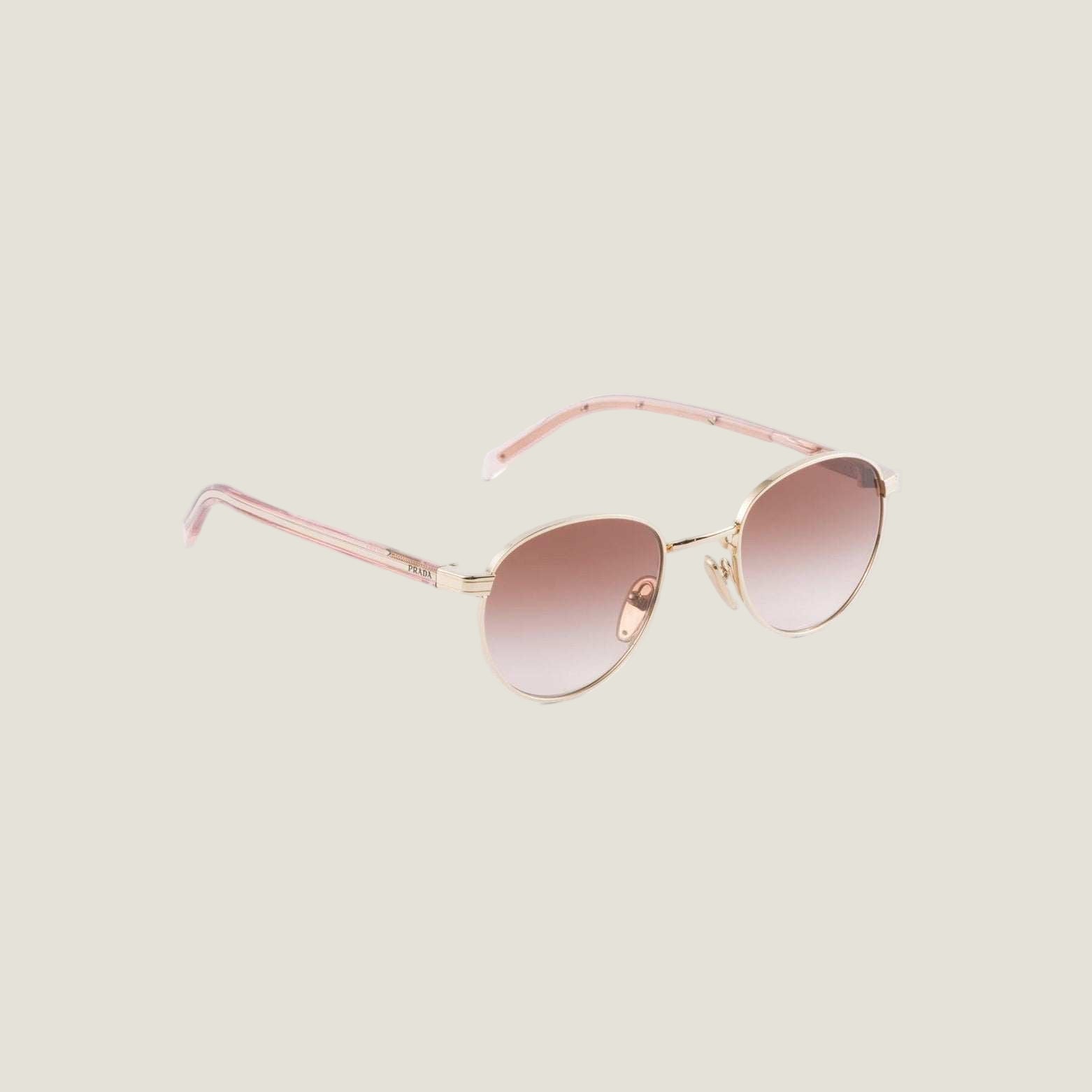 Image of Luxury Prada sunglasses with geometric frames and bold logo, embodying elegance and Italian style.