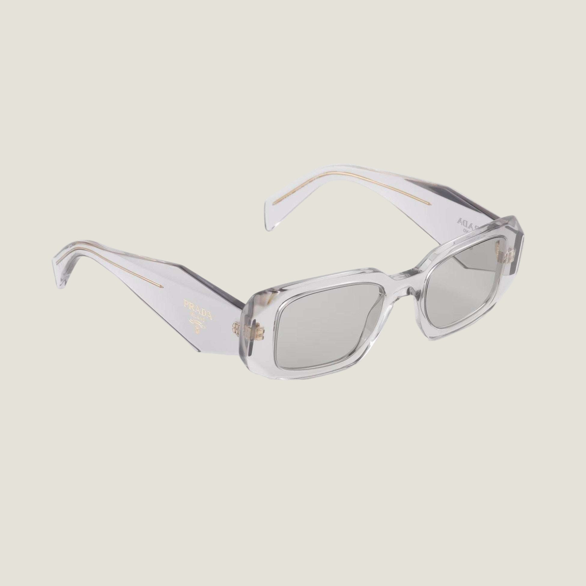 Image of Prada luxury sunglasses with logo, geometric frame, and UV400 lenses.
