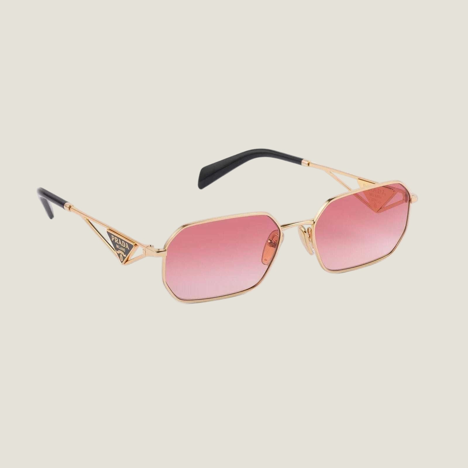 Image of PRADA sunglasses with geometric frames and bold logo, featuring pink lenses.