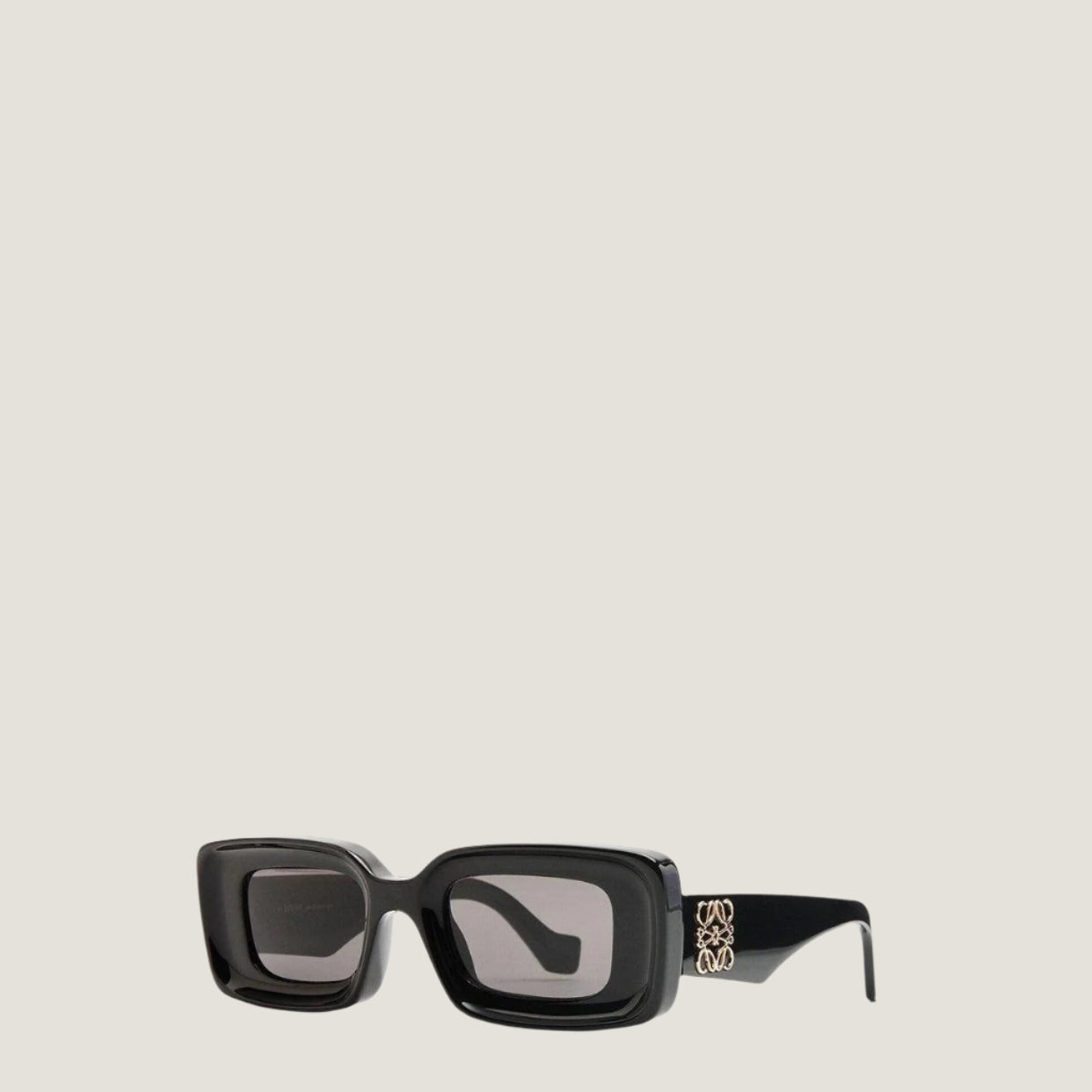 Image of LOEWE sunglasses with geometric black frames and UV400 protection.
