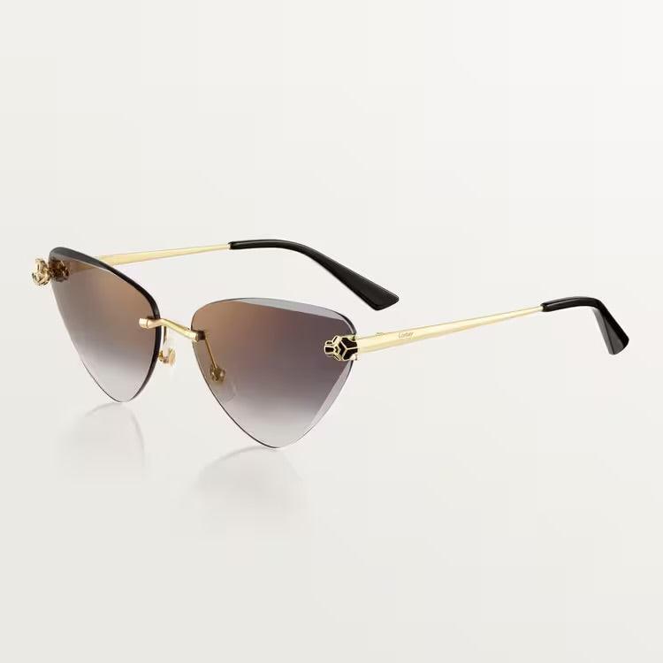 Cartier sunglasses with gold metal frame and UV400 lenses.