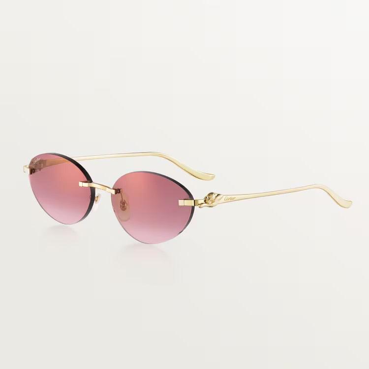 Image of Luxury Cartier sunglasses with gold metal frame and UV400 protection lenses.