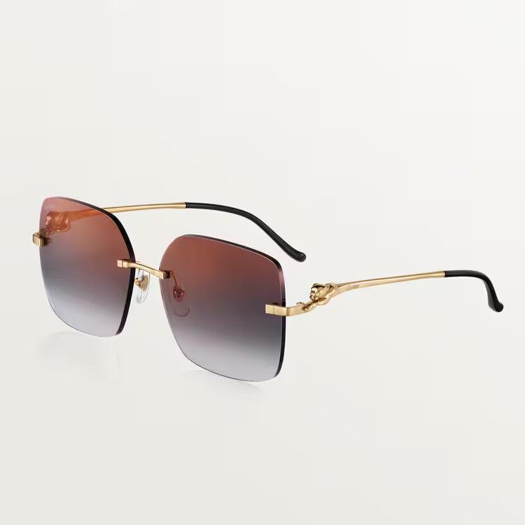 Image of Luxury Cartier sunglasses with gold-plated metal frame and UV400 lenses, unisex design.