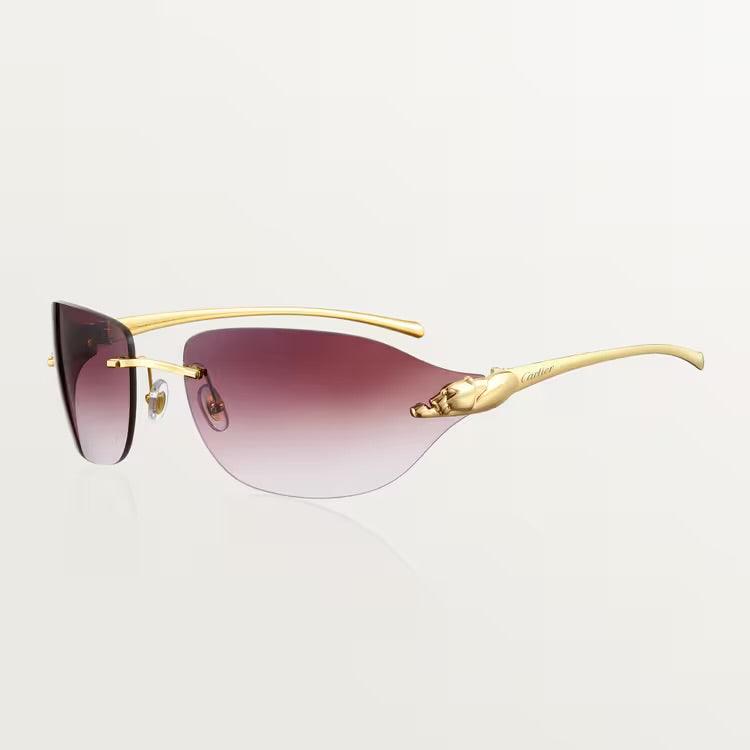 Image of Cartier sunglasses with gold metal frame and UV400 lenses for luxury style and protection.