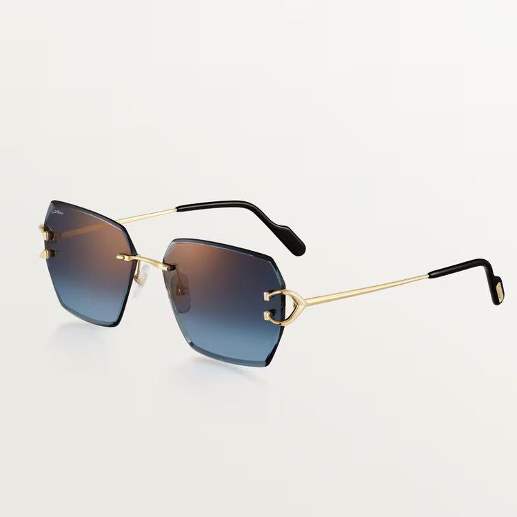 Image of Cartier sunglasses with gold metal frame and UV400 lens protection.