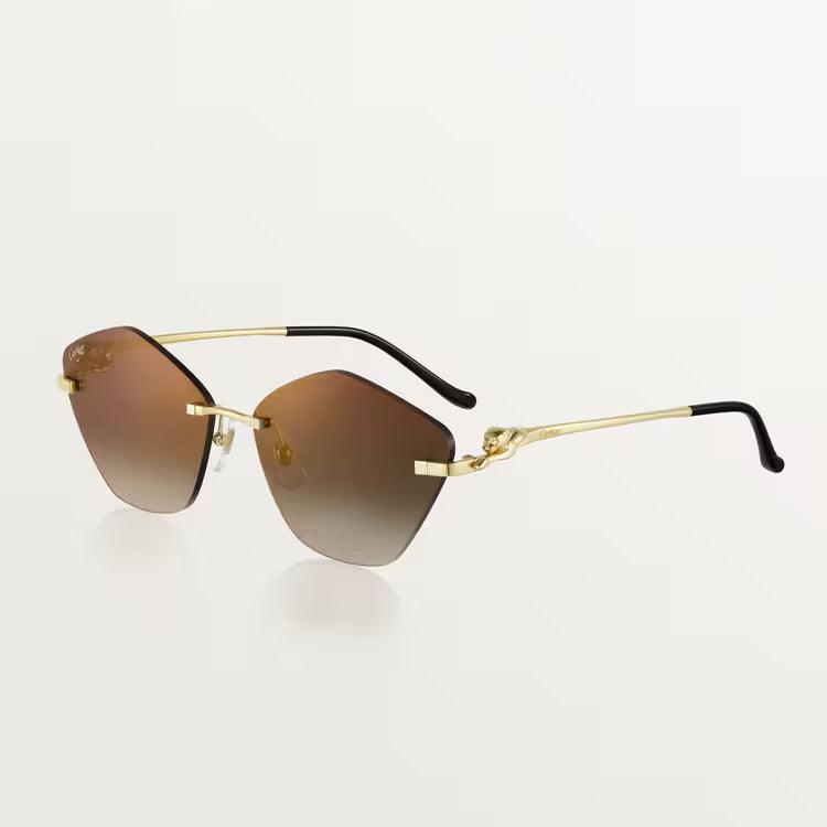 Image of Cartier luxury sunglasses with gold metal frame and UV400 lenses for men and women.