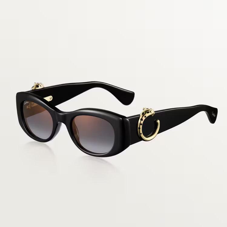 Cartier luxury sunglasses with black frame and dark lenses, featuring gold accents, suitable for both men and women.