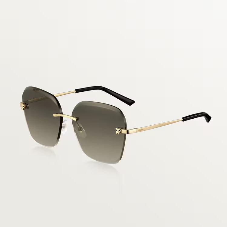 Image of Cartier sunglasses with gold metal frame and UV400 lenses for luxury style and protection.