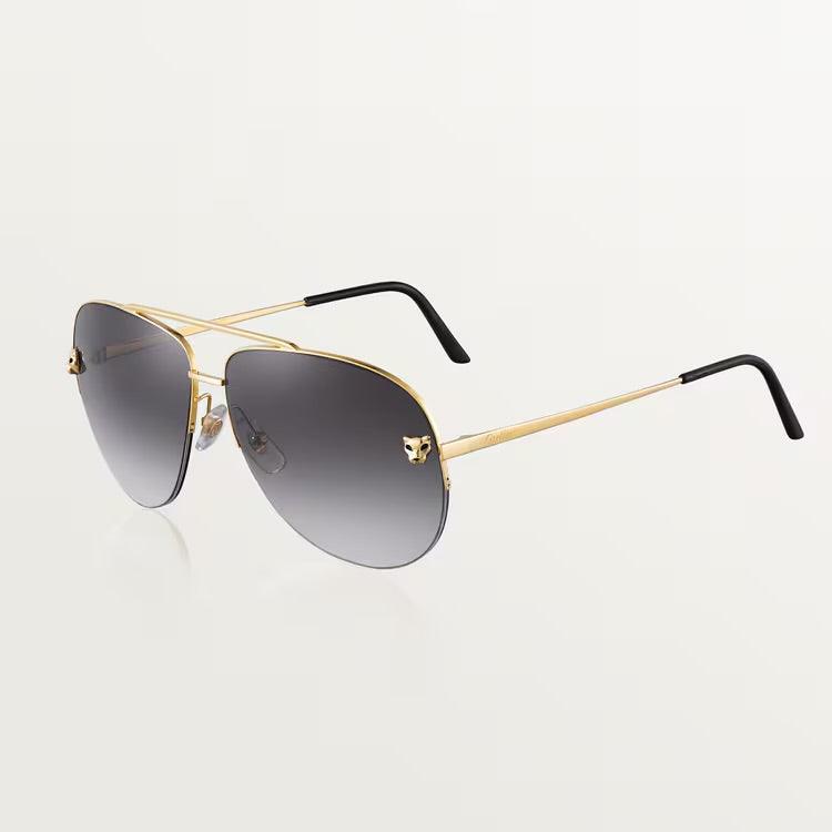 Cartier sunglasses with gold metal frame and UV400 dark lenses.