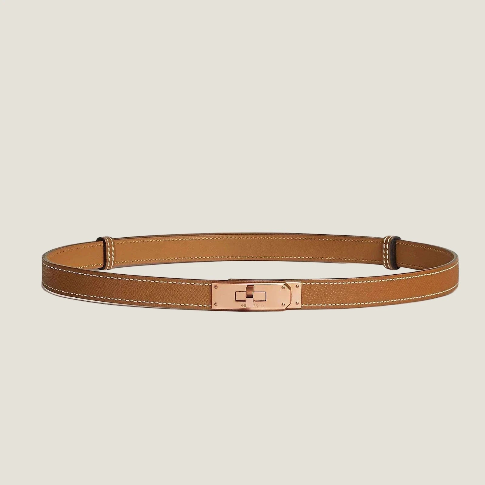 Image of Hermes Kelly leather belt, luxury accessory, premium quality leather, minimalist metallic buckle, unisex design.
