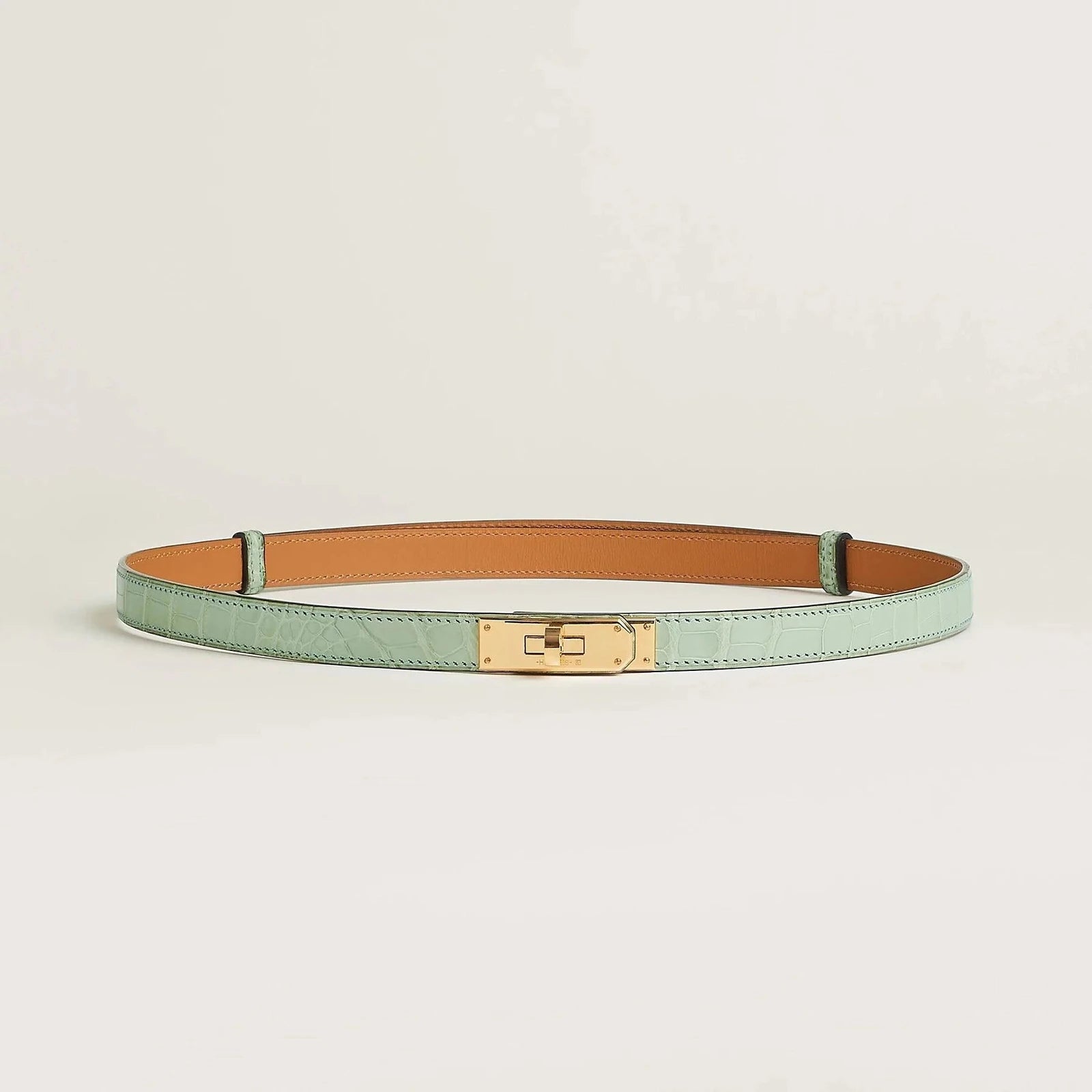 Image of Hermes Kelly belt with gold buckle, premium leather, elegant design.