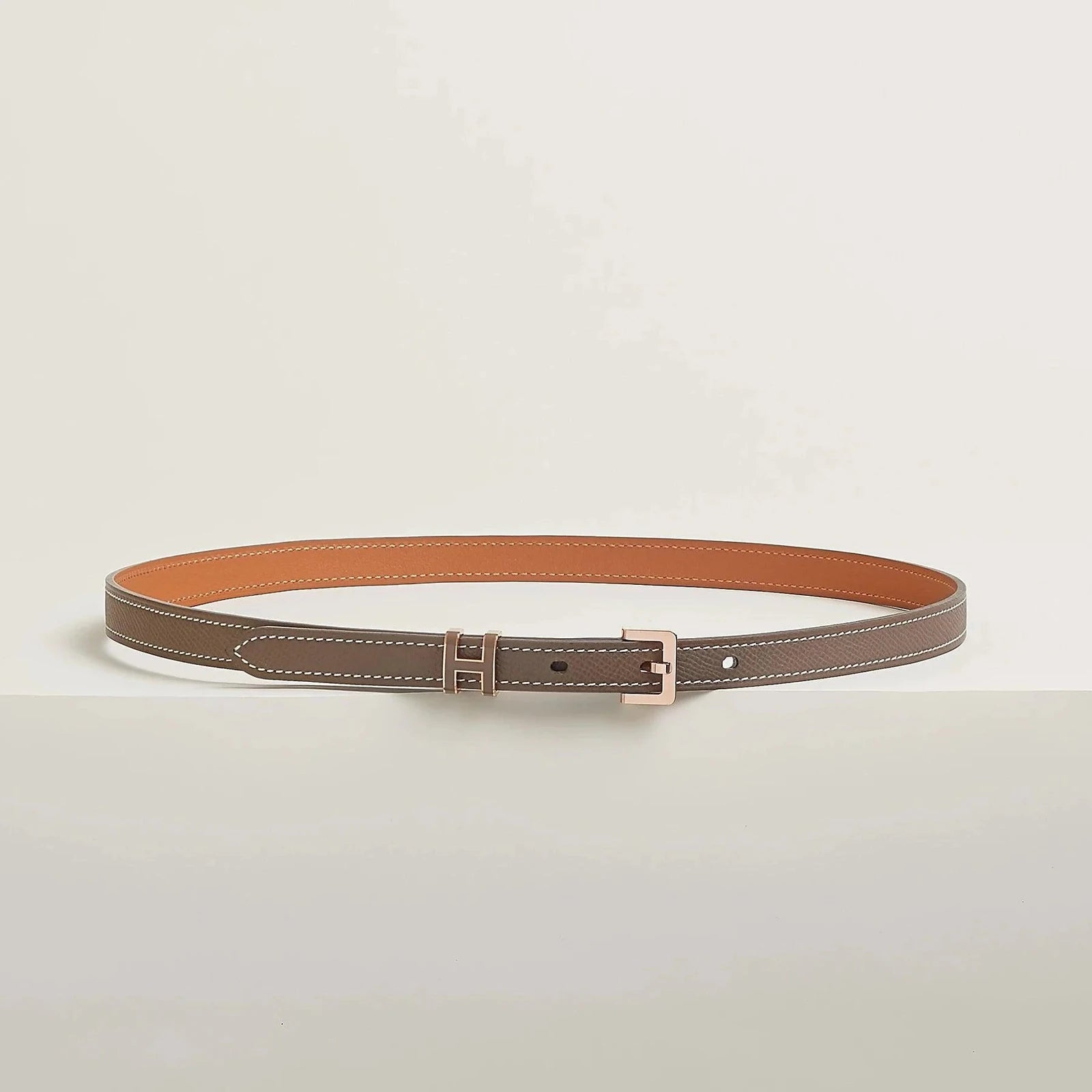 Hermes belt in premium leather with elegant metallic buckle.