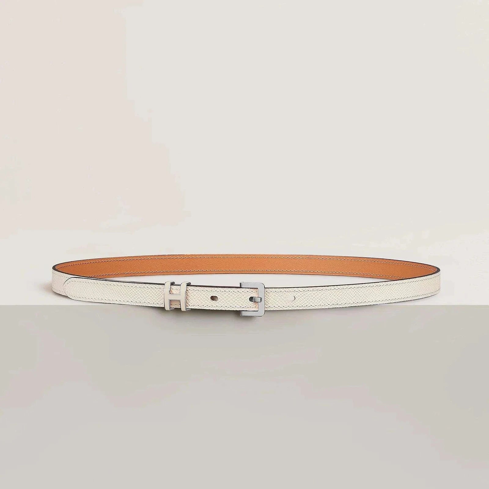 Elegant Hermes belt, premium leather, minimalist design, luxury buckle, unisex fashion.