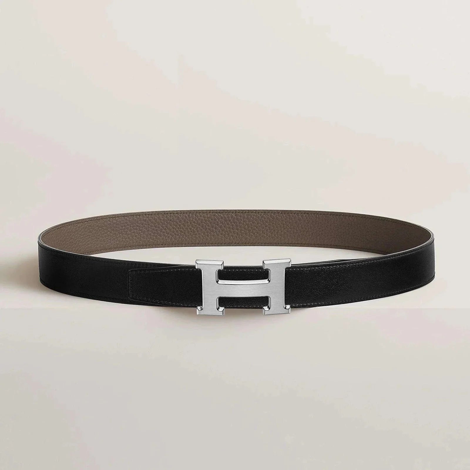Image of Hermes belt with elegant metallic buckle, premium leather, and minimalist design.