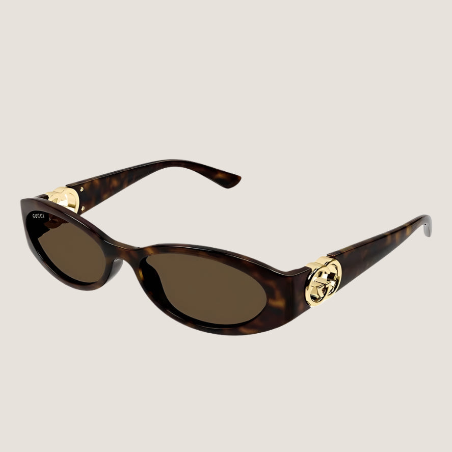 Gucci sunglasses with tortoiseshell frames and gold accents, offering iconic style and UV400 protection.