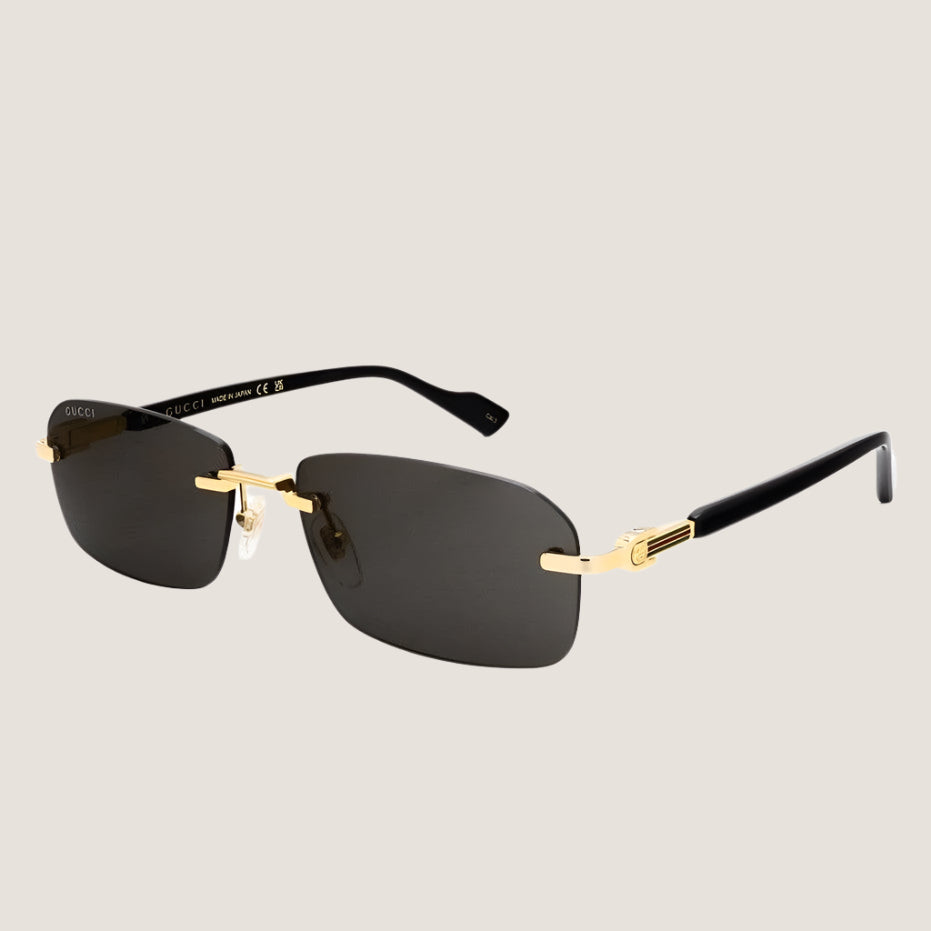 Stylish black metal sunglasses with adjustable nose pads offering 100% UVA/UVB protection.