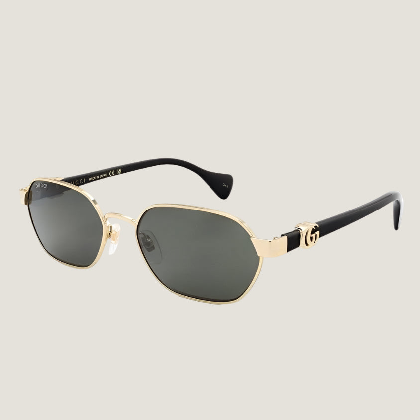 Image of Gucci sunglasses with gold frames and dark lenses, featuring iconic GG logo on the arms.