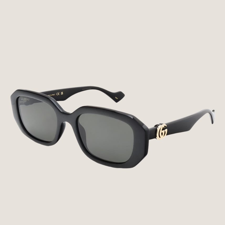 Image of Gucci sunglasses with iconic design and luxury style featuring UV400 lenses and black frames.