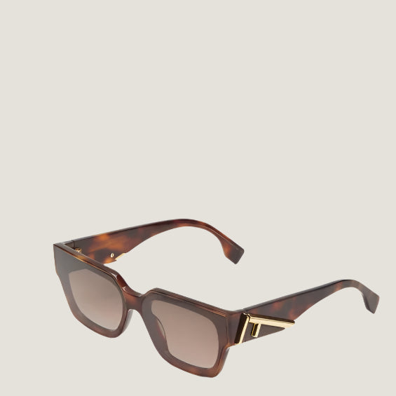 Image of Fendi sunglasses with tortoiseshell frames and UV400 lenses for luxury fashion style.