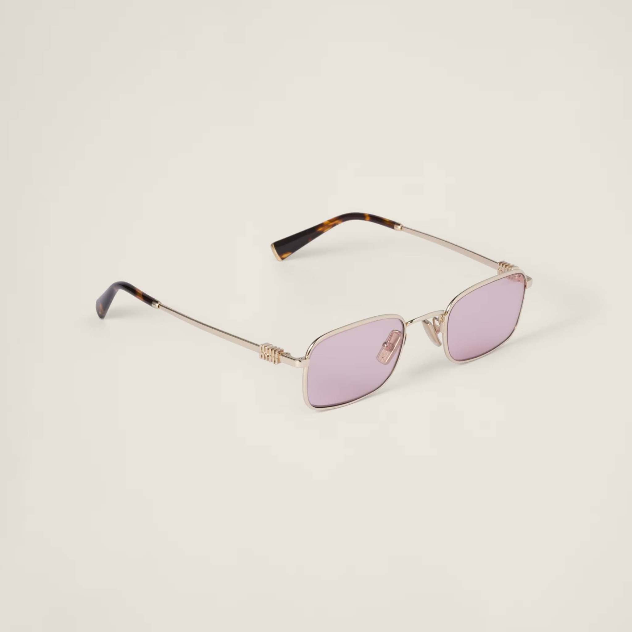 Image of Miu Miu rectangular sunglasses with gold metal frame and adjustable nose pads.