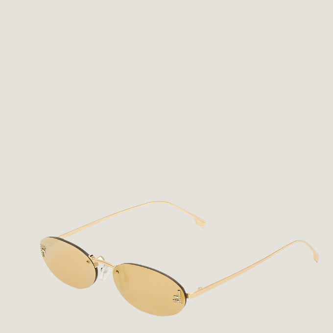 Image of Fendi luxury sunglasses with gold frames and UV400 lenses.