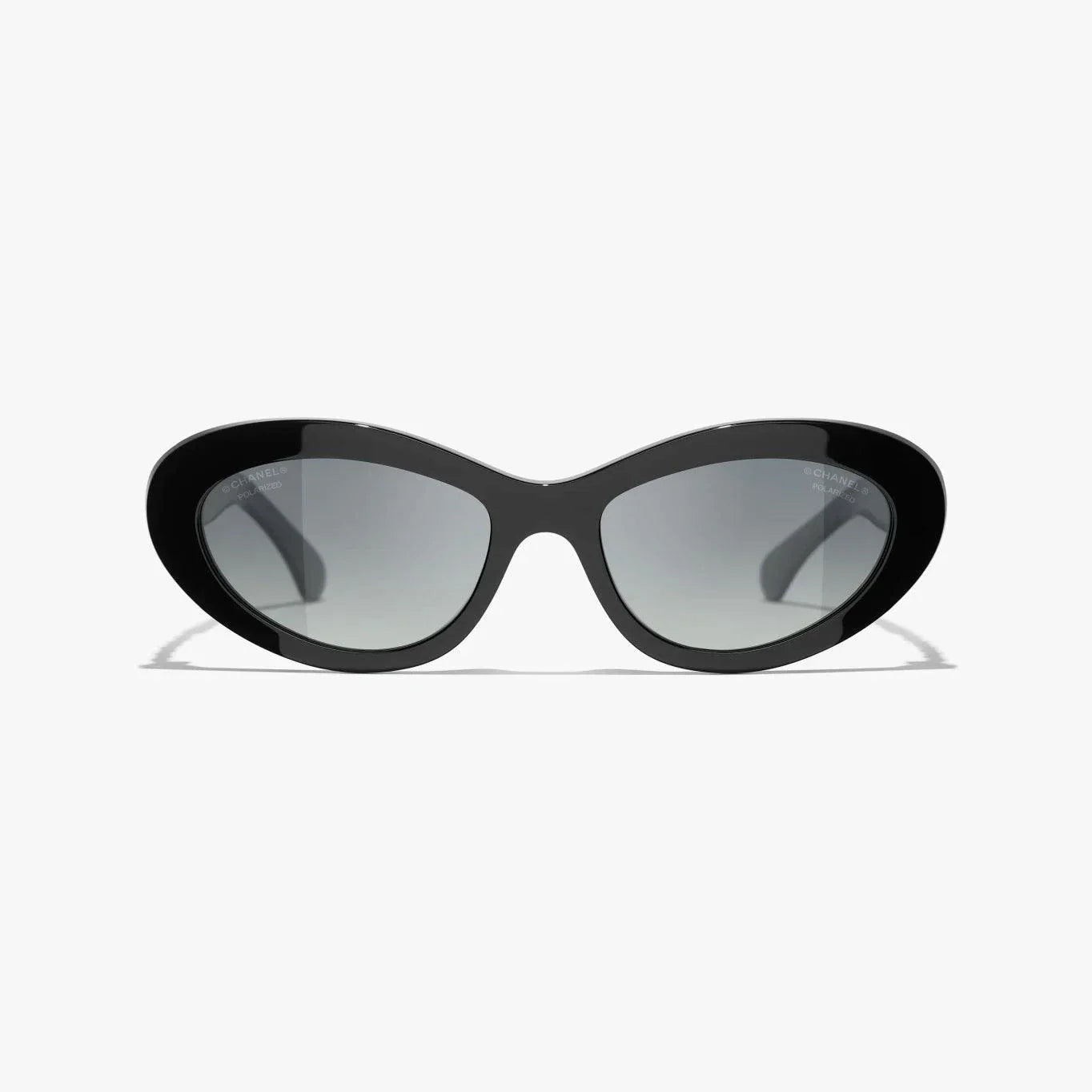 CHANEL sunglasses with black and gold plastic frame, UVA/UVB protection.