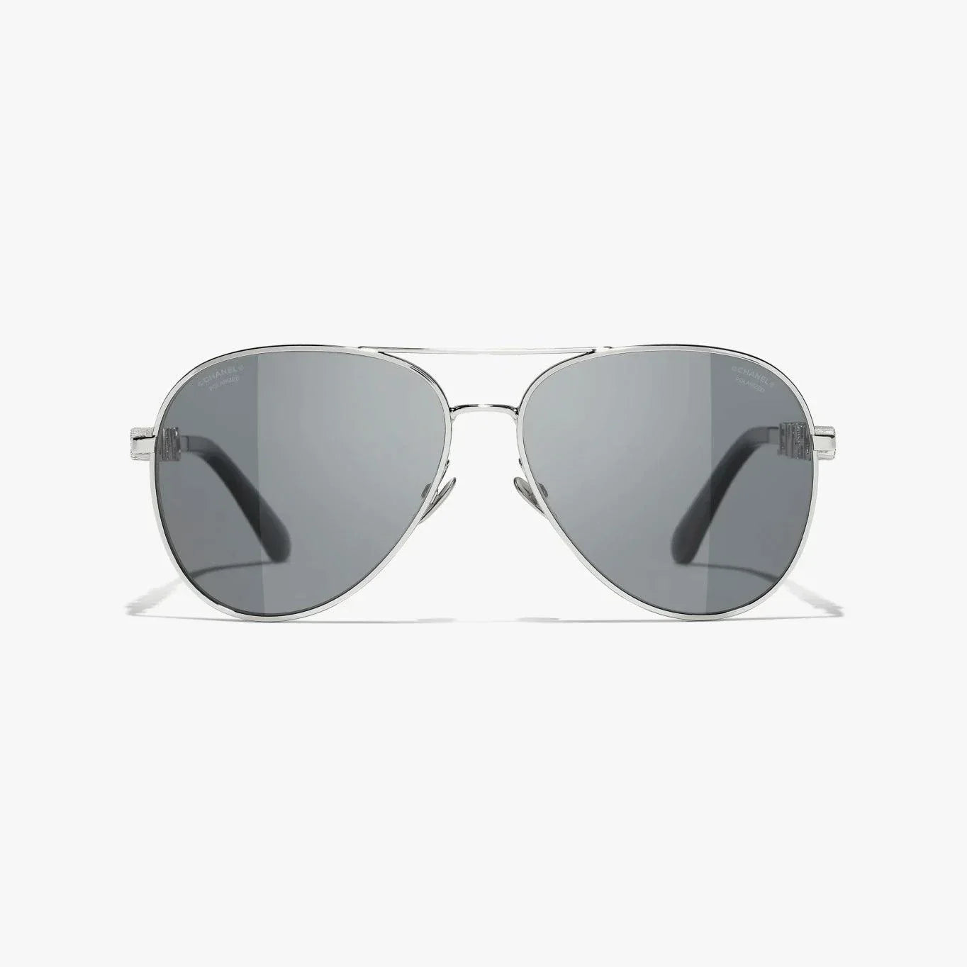 Silver CHANEL sunglasses with plastic frame, UVA/UVB protection, adjustable nose pads.