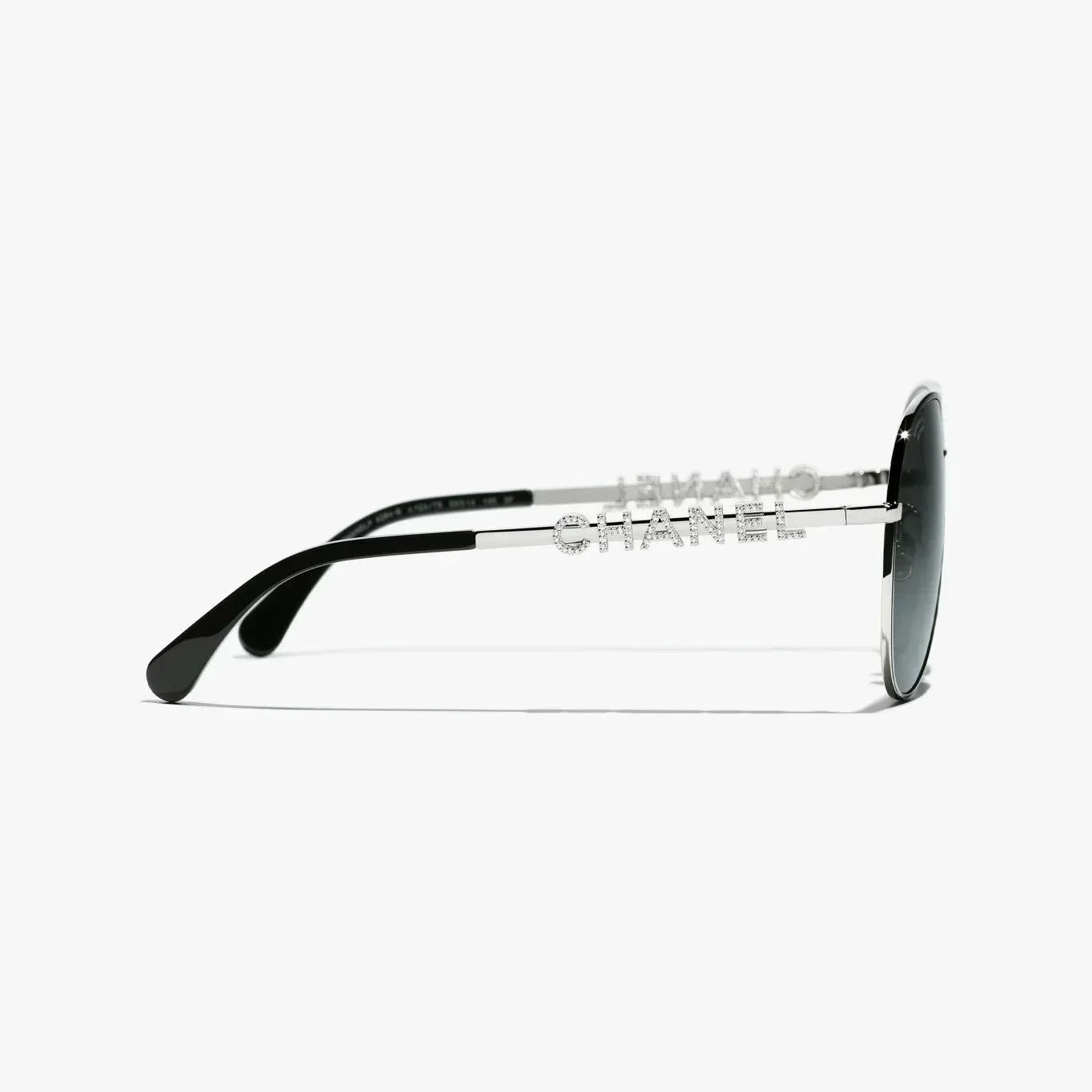 Image of Silver CHANEL sunglasses with plastic frame, UVA/UVB protection, adjustable nose pads.