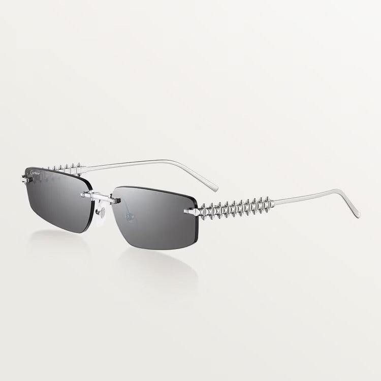 Cartier sunglasses with luxury gold-plated metal frame and UV400 lenses, unisex design.