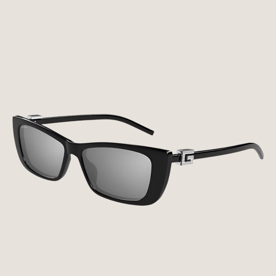 Image of Gucci sunglasses with black frames and UV400 protection lenses.