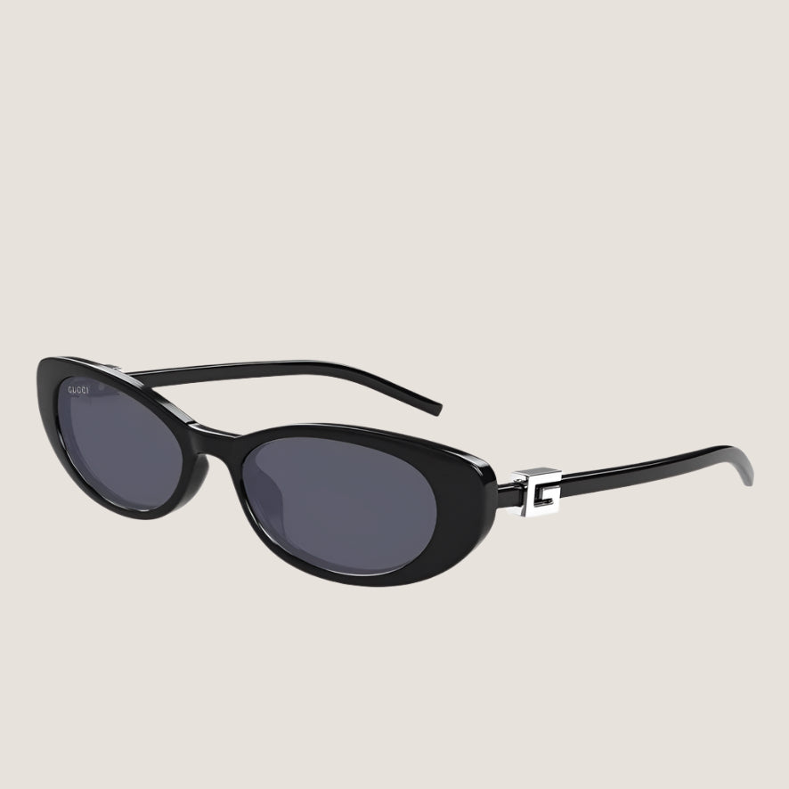 Luxury Gucci sunglasses with sleek black frames and dark lenses.