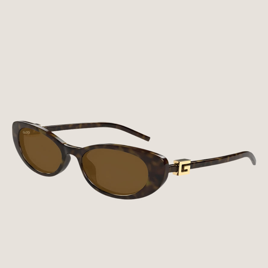משקפי שמש Gucci יוקרתיים בעיצוב איקוני עם עדשות UV400 ומסגרת דגם GG.